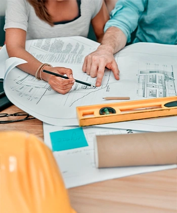 People reviewing construction plans