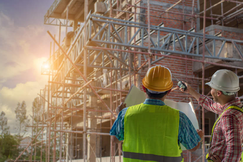 Colombian workers studying the construction capacity of a building.