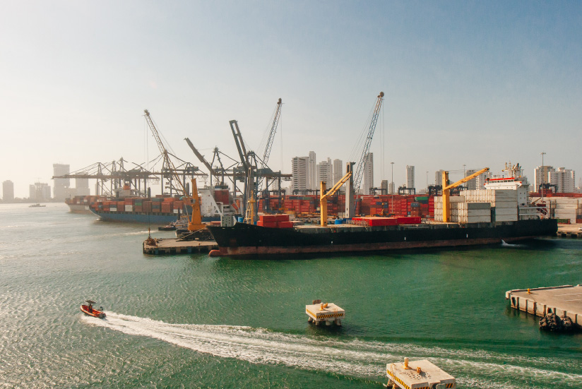 Port of Cartagena with container ships and cranes.