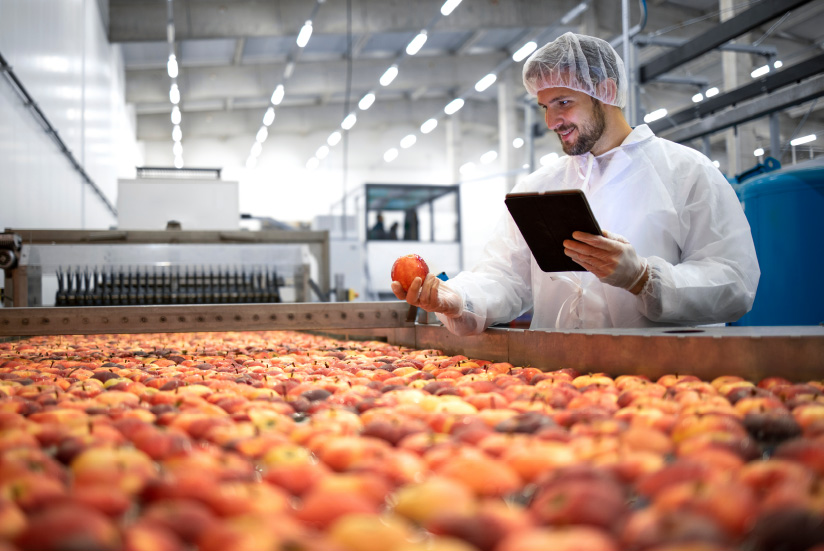 Worker tasting a good for the profitable agribusiness industry.