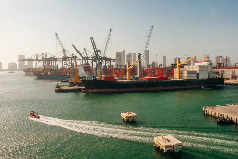Port of Cartagena with container ships and cranes.