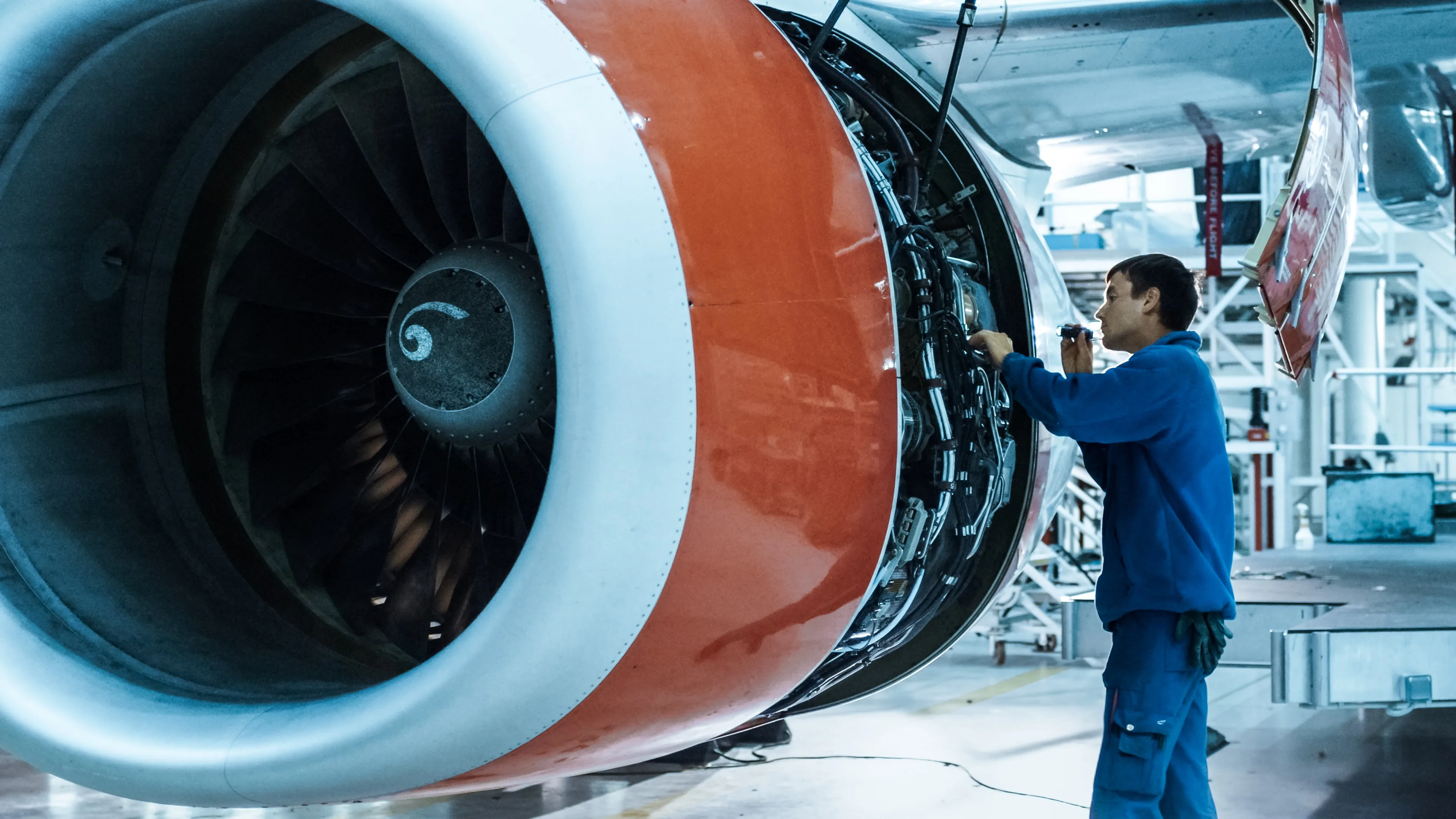 aeronautical engineering worker that is making part of an airplane for the aircraft electrification market