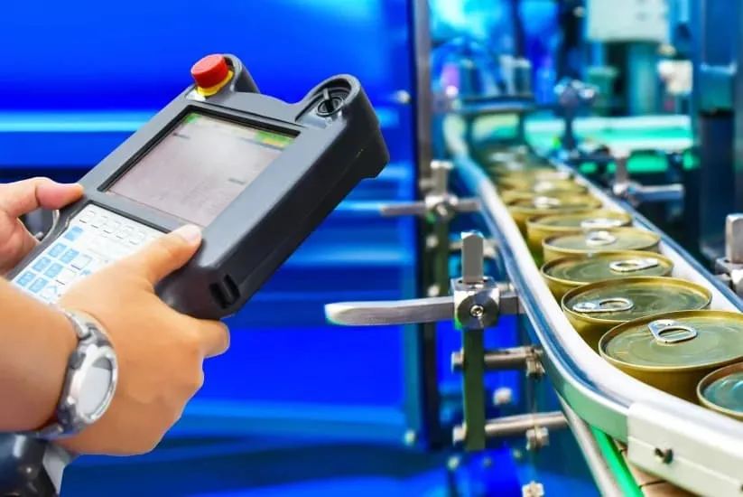 Worker controlling processed food process.