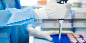 scientist pipetting with hands