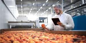 Worker doing a processed food product.
